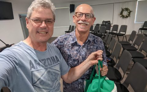 Hope at the Hill collected Cadbury chocolate blocks and attached a Christmas card to be given to inmates at a nearby correctional Centre. Pictured here is the pastor Ken with the chaplain Tim.